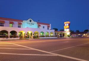 an empty street in front of a hotel at night at Historic Dow Hotel in Lone Pine