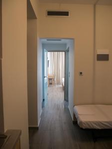 Postel nebo postele na pokoji v ubytování Elegant Beach Hotel