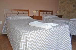 Postel nebo postele na pokoji v ubytování Hotel Rural Val Dos Pigarros