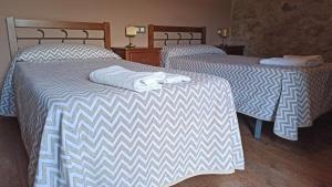 Postel nebo postele na pokoji v ubytování Hotel Rural Val Dos Pigarros