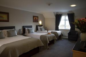 Letto o letti in una camera di The Harbour Inn