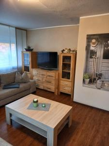 a living room with a couch and a coffee table at Fewo Rietberg in Rietberg