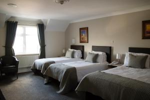 Letto o letti in una camera di The Harbour Inn