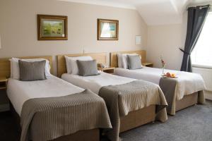Letto o letti in una camera di The Harbour Inn