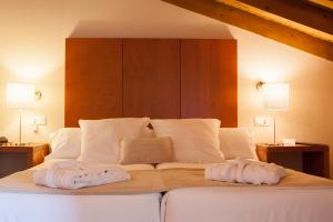 Postel nebo postele na pokoji v ubytování Sotobosque