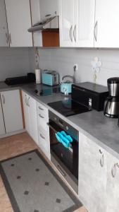 Kuchyňa alebo kuchynka v ubytovaní Apartament na nowej starówce