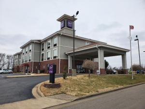 a building with a clock tower on top of it at Sleep Inn & Suites Dyersburg I-155 in Dyersburg