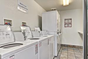 
a kitchen with a white refrigerator and a white counter top at Motel 6-Glenview, IL - Chicago North in Glenview
