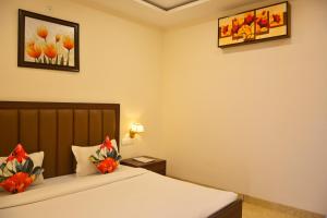 SERENE SUITES客房内的一张或多张床位