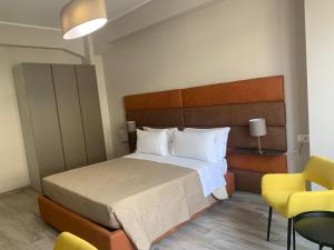 Postel nebo postele na pokoji v ubytování Tripepi suites