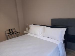 Postel nebo postele na pokoji v ubytování Tripepi suites