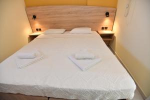 Ένα ή περισσότερα κρεβάτια σε δωμάτιο στο Iskas apartments