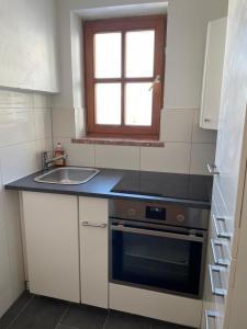 Kuchyňa alebo kuchynka v ubytovaní Apartment Sabrina