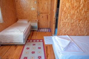 Cama o camas de una habitación en Klas Rafting Pansiyon