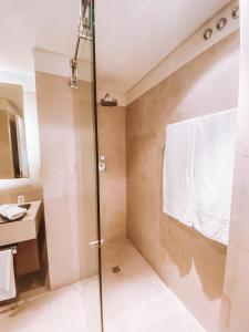 a bathroom with a shower and a sink at Troia - Paraíso a um passo de Lisboa in Troia +27 photos