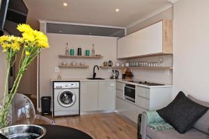 Kuchyň nebo kuchyňský kout v ubytování Aloe Aloe Cottage