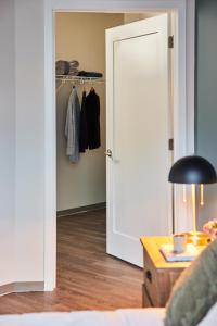 a room with a closet with a open door at Placemakr Premier SoBro in Nashville