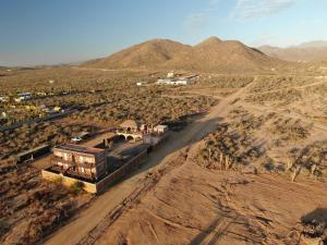 an aerial view of a building in the middle of a desert at Baja69 lodge in El Pescadero