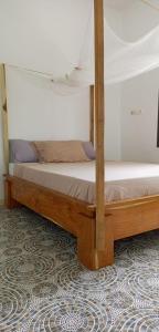 Un pat sau paturi într-o cameră la Zig Coup de Coeur