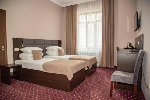 Postel nebo postele na pokoji v ubytování T&S Apart-Hotel + 37 fotografií