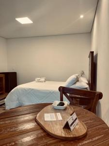 A bed or beds in a room at Pousada Villa Tiradentes