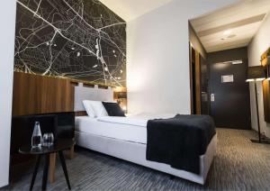 Postel nebo postele na pokoji v ubytování Best Western Hotel Mariacki Katowice