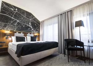 Postel nebo postele na pokoji v ubytování Best Western Hotel Mariacki Katowice