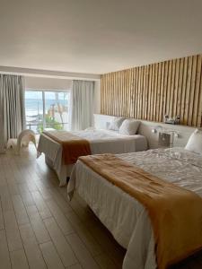 En eller flere senge i et værelse på Castillos Del Mar