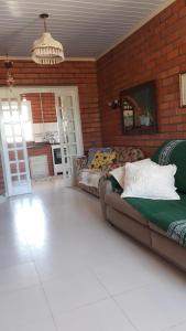 Χώρος καθιστικού στο Gaivota-Casa de Praia para veraneio - temporada Balneário Gaivotas-SC Família Kunhasky