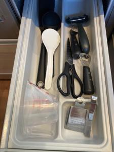 a drawer full of kitchen utensils in a container at KAI Ichinomiya in Ichinomiya