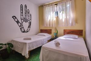 Postel nebo postele na pokoji v ubytování Villas Jacquelina