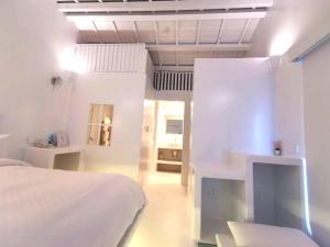 Voodi või voodid majutusasutuse Ample Villa 小希臘民宿 toas