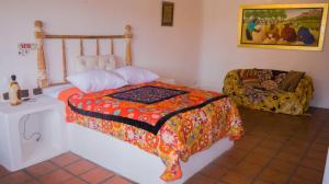 Giường trong phòng chung tại Casa de Campo La Escondida