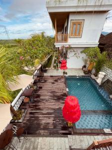 The swimming pool at or close to Surfers Villa and Resorts Medewi