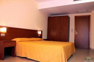 Postel nebo postele na pokoji v ubytování Hotel Sette E Mezzo