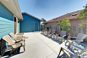 a row of chairs sitting on a patio at Azure Waves in Seaside