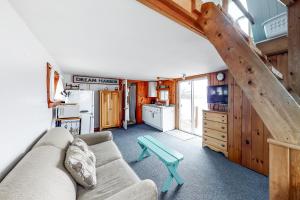 a living room with a couch and a table at Dream Harbor House and Cottage in Surry
