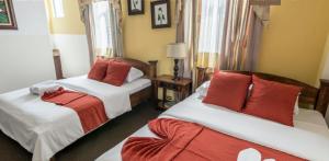 Postel nebo postele na pokoji v ubytování Hotel Amón Real Costa Rica