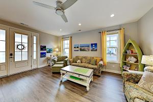 a living room with a couch and a table at The Retreat at Barefoot Village #41 in Myrtle Beach