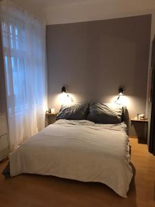 Postel nebo postele na pokoji v ubytování Apartment 26 Eighty