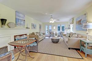 a living room with a couch and a table at 2714 Bayonne Street in Sullivans Island