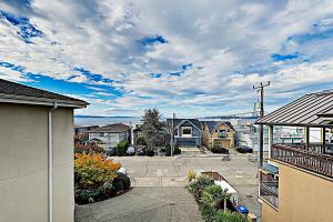 a view of a street with houses and a sky at Alki Adventures in Seattle