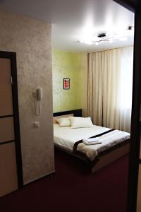 Postelja oz. postelje v sobi nastanitve Amigo Hotel