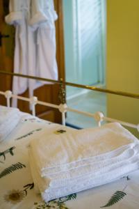 a close up of a bed with a towel on it at The Sunshine Annex at Lower Fields Farm in Napton on the Hill