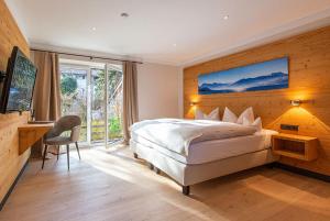 Postel nebo postele na pokoji v ubytování Hotel Berlin Tegernsee