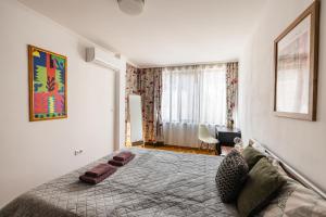 Postel nebo postele na pokoji v ubytování Matisse Hotflat
