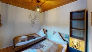 Ein Bett oder Betten in einem Zimmer der Unterkunft Ferienhaus Siesta Hahnenklee mit großem Grundstück