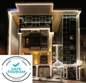 a building with the safe tourism sign in front of it at Alpinn Hotel Istanbul in Istanbul