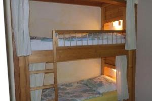 a couple of bunk beds in a room at Ferienhaus Simon in Pörtschach am Wörthersee