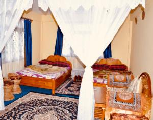 Postel nebo postele na pokoji v ubytování Dew Drop Homestay + 20 fotografií